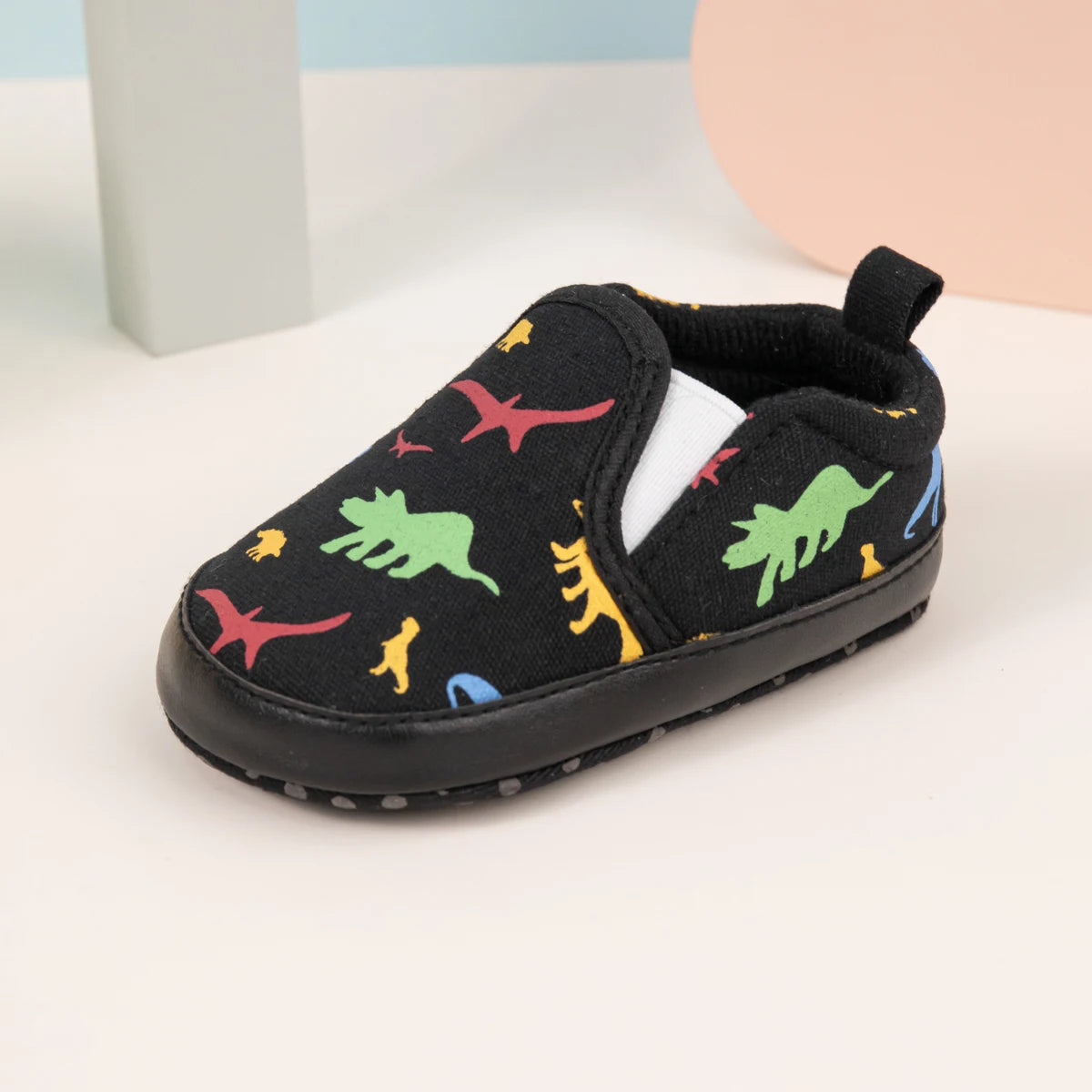 Chaussons black slip-on bébé avec motifs de dinosaures colorés pour enfants